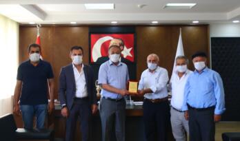 Muhtardan, Sarı’ya Plaket